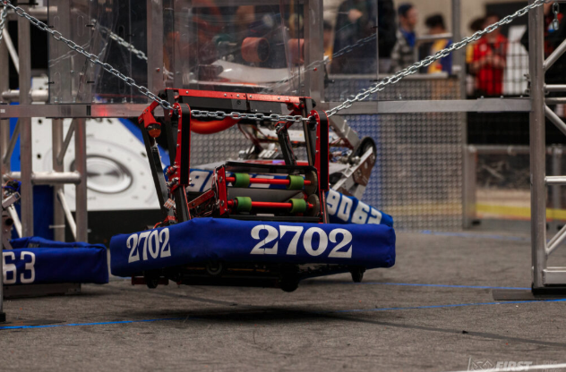 Robot 2702 climbing at competition