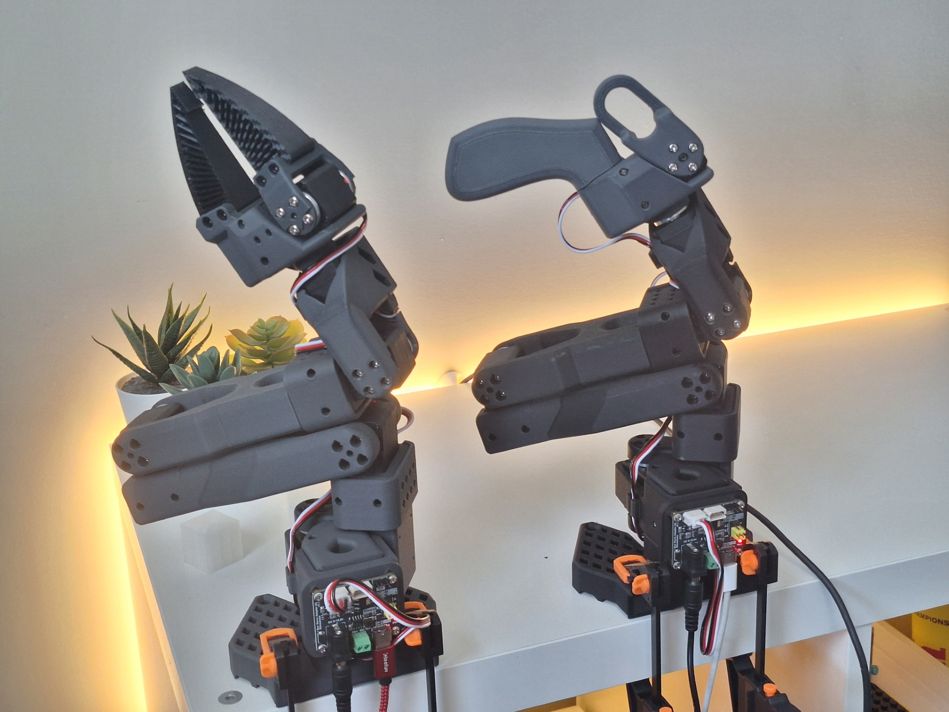SO-101 arms with custom 3D-printed gripper jaws