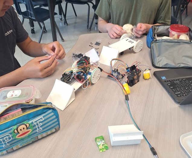 Students assembling sumo bots